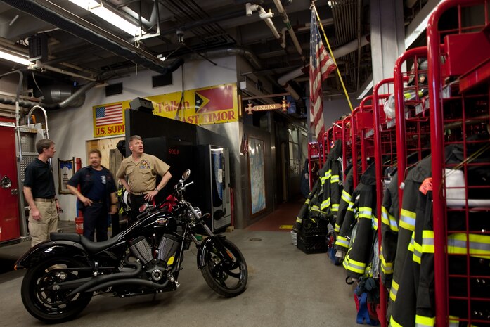 Following a reenlistment ceremony at Ground Zero, Lt. Gen. Richard F. Natonski, commander for U.S. Marine Corps Forces Command, visited Ladder 10, located directly across the street from the World Trade Center site, to speak with New York City Fire Department fire fighters, May 10. (Official Marine Corps photo by: Cpl. Patrick Fleischman)
