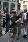 A boy poses with a m16A4 rifle while at Marine Day in Times Square, N.Y. Marines from Special Purpose Marine Air Ground Task Force New York displayed weapons, equipment and their hand-to-hand fighting techniques at the all-day event. (Official Marine Corps photo by Sgt. Steve Cushman)