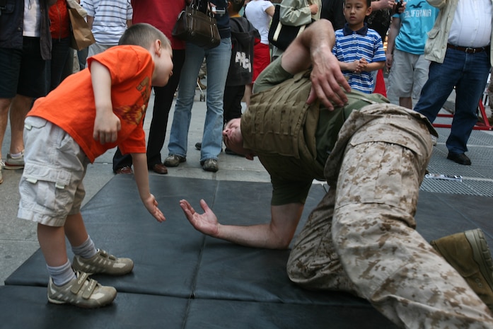 Marines from Special Purpose Marine Air Ground Task Force New York demonstrate the Marine Corp Martial Arts Program (MCMAP) as part of Marine Day in Times Square. The Marines developed a martial arts discipline by mixing together most of today's popular fighting techniques. (Official Marine Corps photo by Sgt. Steve Cushman)
