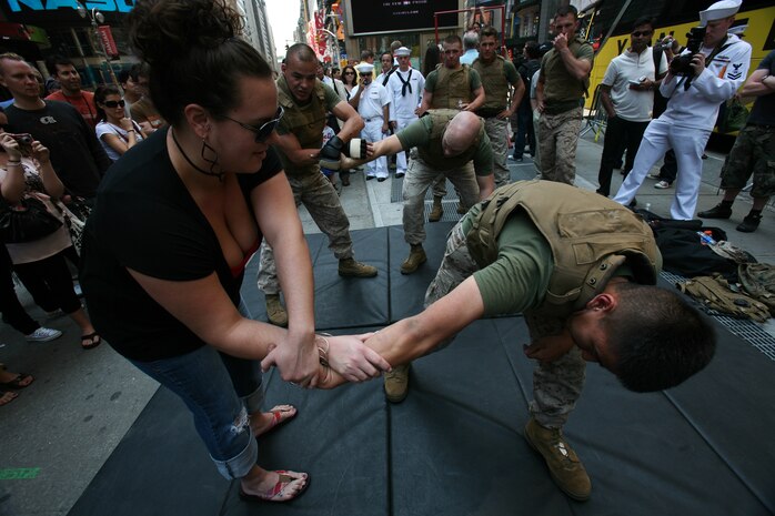 Marines from Special Purpose Marine Air Ground Task Force New York demonstrate the Marine Corp Martial Arts Program (MCMAP) as part of Marine Day in Times Square. The Marines developed a martial arts discipline by mixing together most of today's popular fighting techniques. (Official Marine Corps photo by Sgt. Steve Cushman)