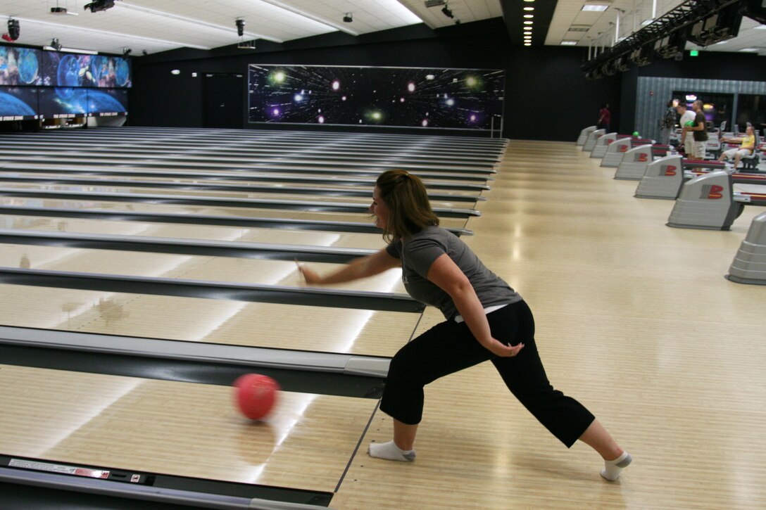 Brandy Miller, of the only all-female team that competed, bowls her only strike during Four Strikes and You're Out, the seventh challenge of the Amazing Race her May 22. The object of the challenge was for each team to bowl four stikes before proceeding  on to the next challenge.