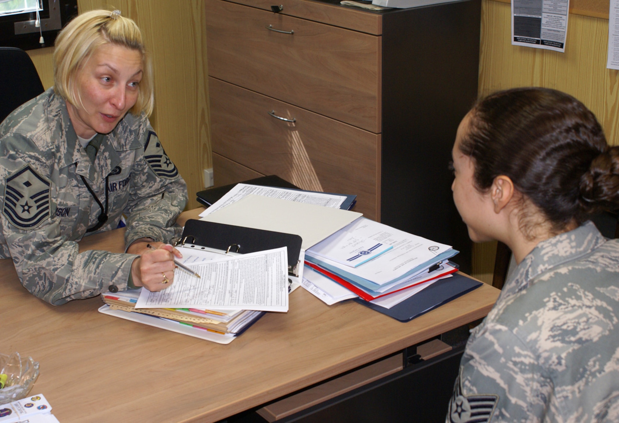 SPANGDAHLEM AIR BASE, Germany -- Master Sgt. Nichole Johnson, 52nd Aircraft Maintenance Squadron, talks with Staff Sgt. Jacqueline Stokes, 52nd AMXS, about the importance of a family care plan. For information about applying for first sergeant duty, talk to your unit first sergeant. (U.S. Air Force photo by Senior Master Sgt. Dennis Wingett)