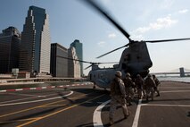 On a helipad on the lower-east side of Manhattan, Marines from 2nd Battalion, 6th Marine Regiment with Special Purpose Marine Air Ground Task Force -New York, led by 24th Marine Expeditionary Unit, load onto a CH-46E Sea Knight to travel to a simulated raid of Eisenhower Park in Long Island, N.Y.,  May 23. The event allowed area residents to walk through helicopters and view static displays of weapons.The 24th MEU has more than 900 Marines who are slated to showcase several events for New York's Fleet Week 2009. (Official Marine Corps photo by: Cpl. Patrick Fleischman)