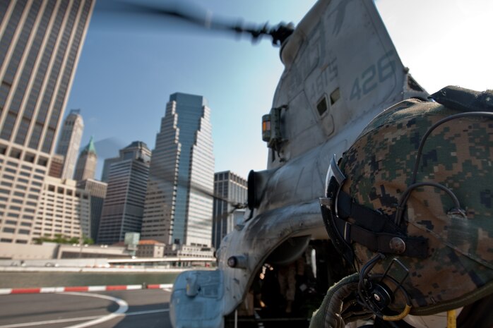 On a helipad on the lower-east side of Manhattan, a Marine from 2nd Battalion, 6th Marine Regiment with Special Purpose Marine Air Ground Task Force -New York, led by 24th Marine Expeditionary Unit, radios to the pilot of a CH-46E Sea Knight, which will be traveling to a simulated raid of Eisenhower Park in Long Island, N.Y.,  May 23. The event allowed area residents to walk through helicopters and view static displays of weapons. The 24th MEU has more than 900 Marines who are slated to showcase several events for New York's Fleet Week 2009. (Official Marine Corps photo by: Cpl. Patrick Fleischman)