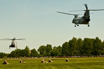 A CH-46E Sea Knight and AH-1W Cobra take off after dropping off Marines from 2nd Battalion, 6th Marine Regiment with Special Purpose Marine Air Ground Task Force New York, led by 24th Marine Expeditionary Unit. The Marines are simulating a raid of Eisenhower Park in Long Island, N.Y.,  May 23. The event allowed area residents to walk through helicopters and view static displays of weapons. The 24th MEU has more than 900 Marines who are slated to showcase several events for New York's Fleet Week 2009. (Official Marine Corps photo by: Cpl. Patrick Fleischman)
