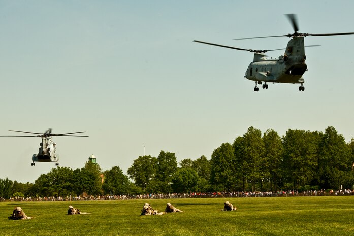 A CH-46E Sea Knight and AH-1W Cobra take off after dropping off Marines from 2nd Battalion, 6th Marine Regiment with Special Purpose Marine Air Ground Task Force New York, led by 24th Marine Expeditionary Unit. The Marines are simulating a raid of Eisenhower Park in Long Island, N.Y.,  May 23. The event allowed area residents to walk through helicopters and view static displays of weapons. The 24th MEU has more than 900 Marines who are slated to showcase several events for New York's Fleet Week 2009. (Official Marine Corps photo by: Cpl. Patrick Fleischman)