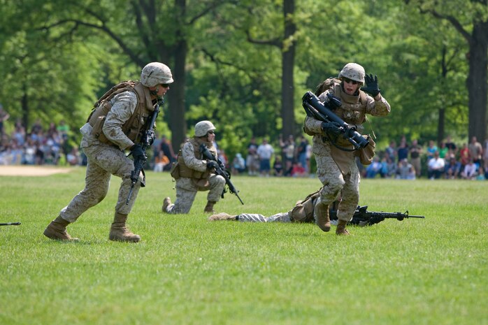 Marines from 2nd Battalion, 6th Marine Regiment with Special Purpose Marine Air Ground Task Force New York, led by 24th Marine Expeditionary Unit, conduct a simulated raid of Clove Lakes Park in Staten Island, N.Y.,  May 23. The event allowed area residents to walk through helicopters and view static displays of weapons. The 24th MEU has more than 900 Marines who are slated to showcase several events for New York's Fleet Week 2009. (Official Marine Corps photo by: Cpl. Patrick Fleischman)
