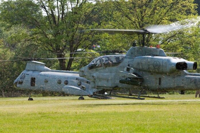 A CH-46E Sea Knight and AH-1W Cobra helicopters land following a drop off of Marines from 2nd Battalion, 6th Marine Regiment with Special Purpose Marine Air Ground Task Force New York, led by 24th Marine Expeditionary Unit, who conducted a simulated raid of Clove Lakes Park in Staten Island, N.Y.,  May 23. The event allowed area residents to walk through helicopters and view static displays of weapons. The 24th MEU has more than 900 Marines who are slated to showcase several events for New York's Fleet Week 2009. (Official Marine Corps photo by: Cpl. Patrick Fleischman)