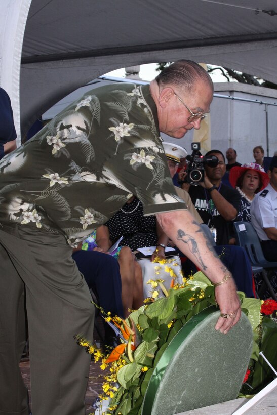 Retired Marine Sgt. Maj. Allan J. Kellogg Jr., a recipient of the Medal of Honor, lays a wreath in honor of Vietnam War veterans during a candlelight ceremony at the National Memorial Cemetery of the Pacific here May 24.