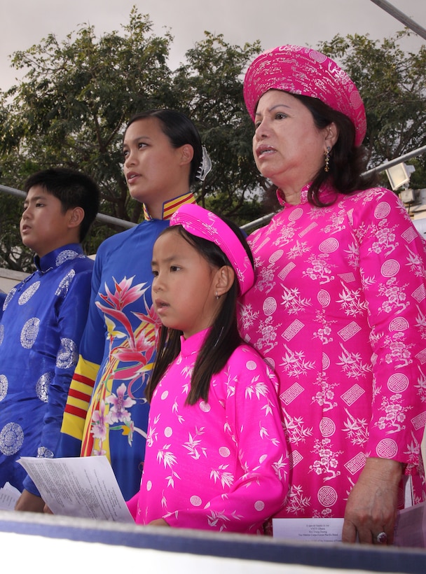 Members of the Vietnamese Today's Vision, a non-profit organization that promotes and preserves Vietnamese culture, sing in honor of Vietnamese and American service members who fought for their country more than 30 years ago during a ceremony at the National Memorial Cemetery of the Pacific here May 24.