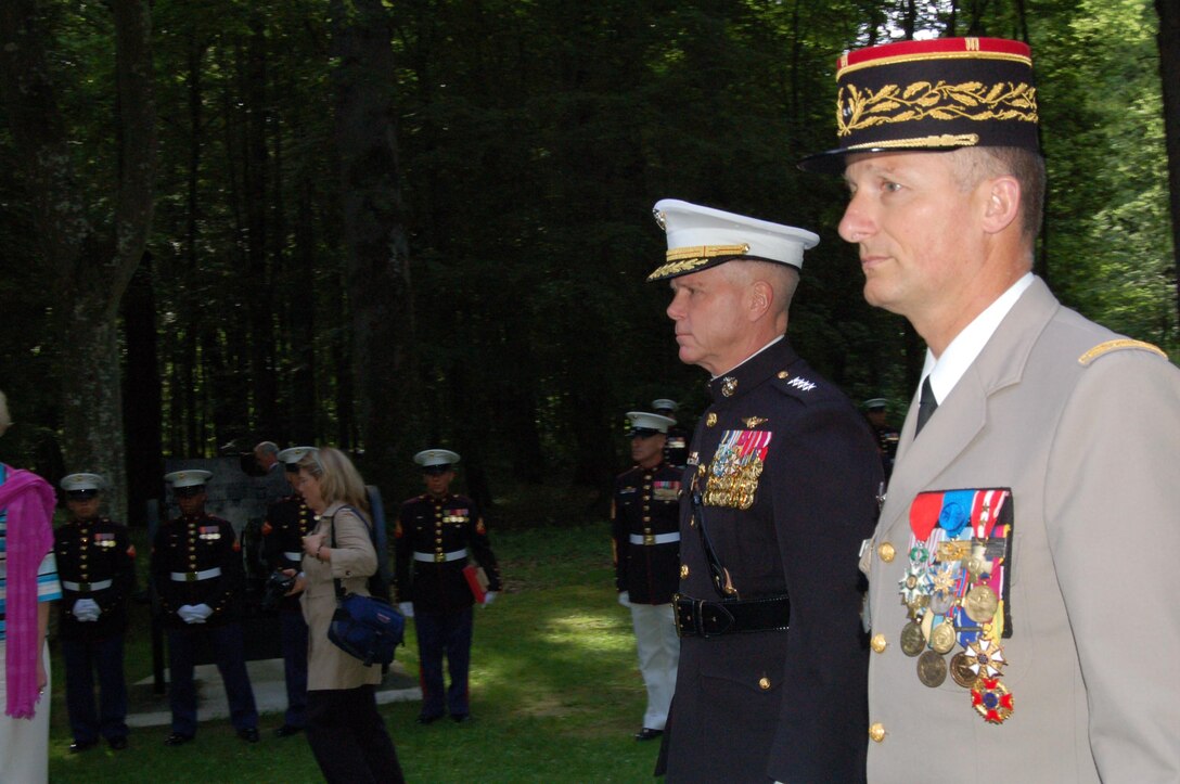 Assistant Commandant of the  Marine Corps Gen. James F. Amos, along with French Brig. Gen. Eric  Bonnemaison, Commandant of the 9th Brigade Legere Blindee de Marine, arrive at  Belleau Wood for a wreath-laying ceremony at the feet of Iron Mike.  The early  morning ceremony marked the beginning of a series of Memorial Day events at  the Aisne-Marne American Cemetery.  Each year, thousands of U.S. and French  service members, their families, tourists and locals, gather to honor the  memories of the 2,289 war-dead buried at the cemetery.