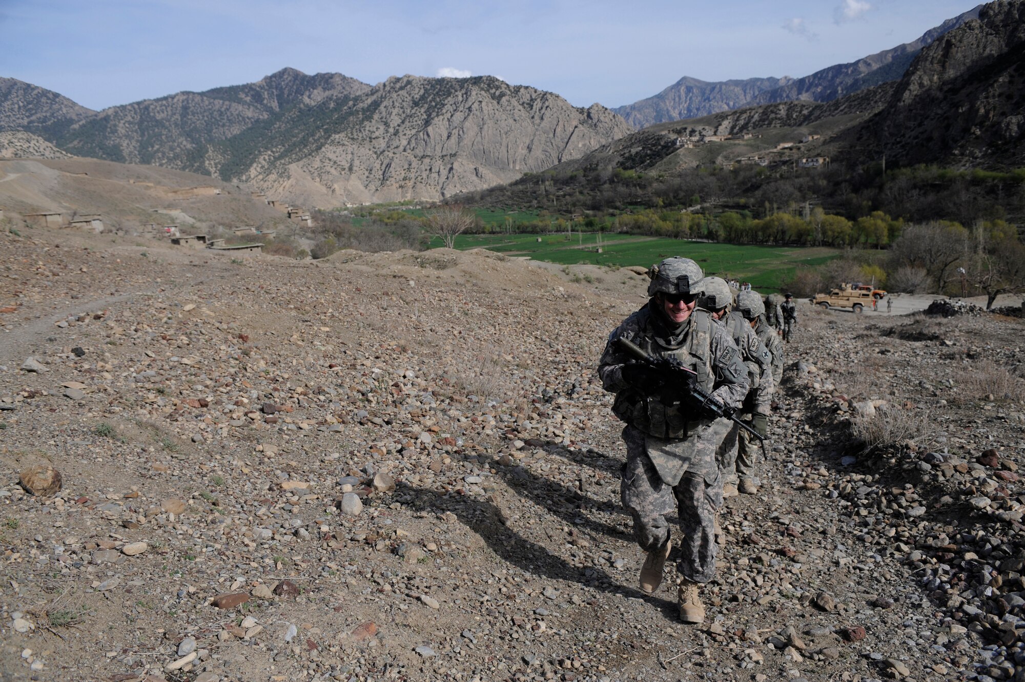 U.S. Air Force Capt. Don Moss, Chief of Intelligence, Paktya Provincial Reconstruction Team, walks to new school being built in a village near Forward Operating Base Herrara, Afghanistan, April 16, 2009. (U.S. Air Force photo by Staff Sgt. Shawn Weismiller)