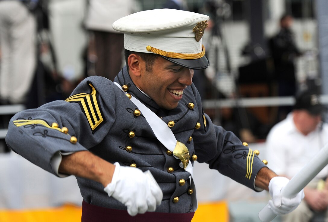 After receiving his diploma from Defense Secretary Robert M. Gates a graduate celebrates his achievement at the U.S. Army Military Academy at West Point, N.Y.,  May 23, 2009.