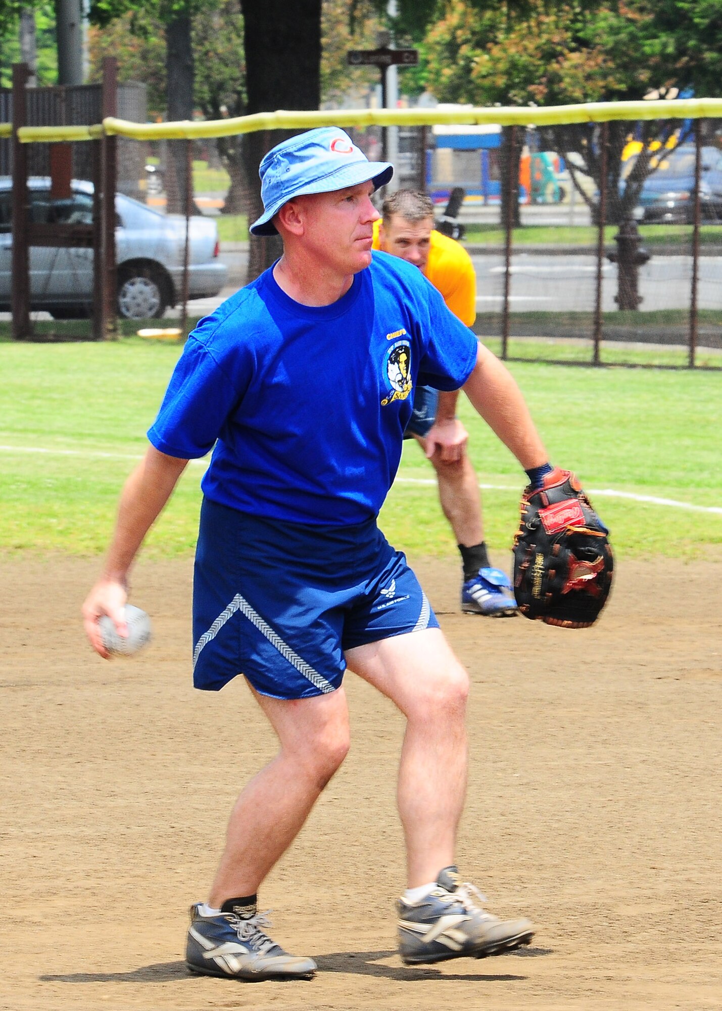 YOKOTA AIR BASE, Japan -- Chief Master Sgt. Kevin Peters, 374th Security Forces Squadron, pitches to fellow chiefs during the one-pitch Chiefs vs. Eagles game May 21 during Yokota's Safety and Sports Day. The Chiefs squeeked by the Eagles 3-2. Safety and sports day helped the base kickoff the 101 Critical Days of Summer, which runs through Labor Day.(U.S. Air Force photo/Airman Sean Martin)

