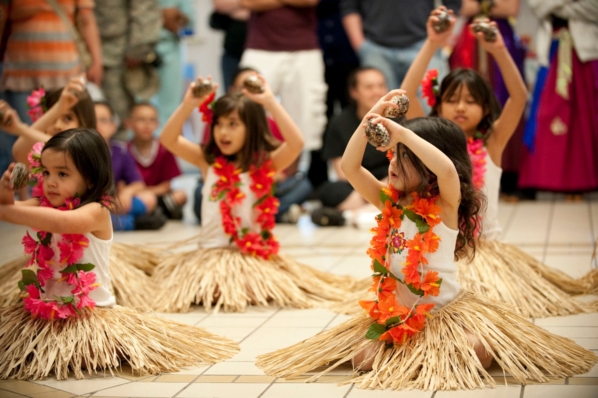 MISAWA AIR BASE, Japan -- Children perform a hula dance with sea shells at the Misawa Base Exchange May 16, 2009. A team like this allows children of Asian-Pacific descent to practice and share their cultural heritage here at Misawa Air Base. (U.S. Air Force photo by Staff Sgt. Samuel Morse)