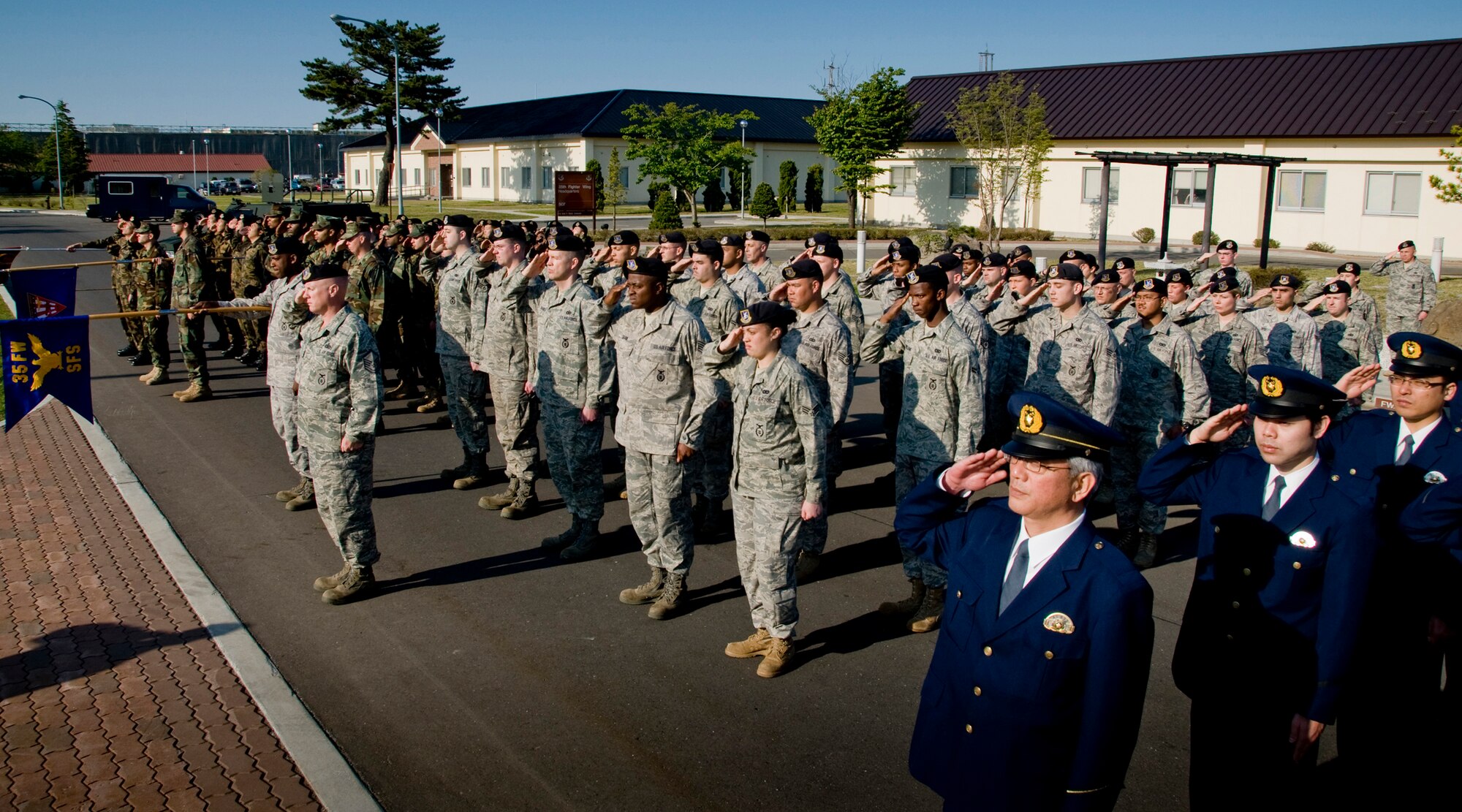 MISAWA AIR BASE, Japan -- Members of the Japan Air Self-Defense Force Transportation and Security Squadron, Naval Air Facility Security, 35th Security Forces Squadron and Misawa City Police Station take part in a retreat ceremony to wrap up National Police Week May 15, 2009. The ceremony also served as a chance to strengthen bonds amongst the various security and police agencies of the surrounding area. (U.S. Air Force photo by Senior Airman Jamal D. Sutter)