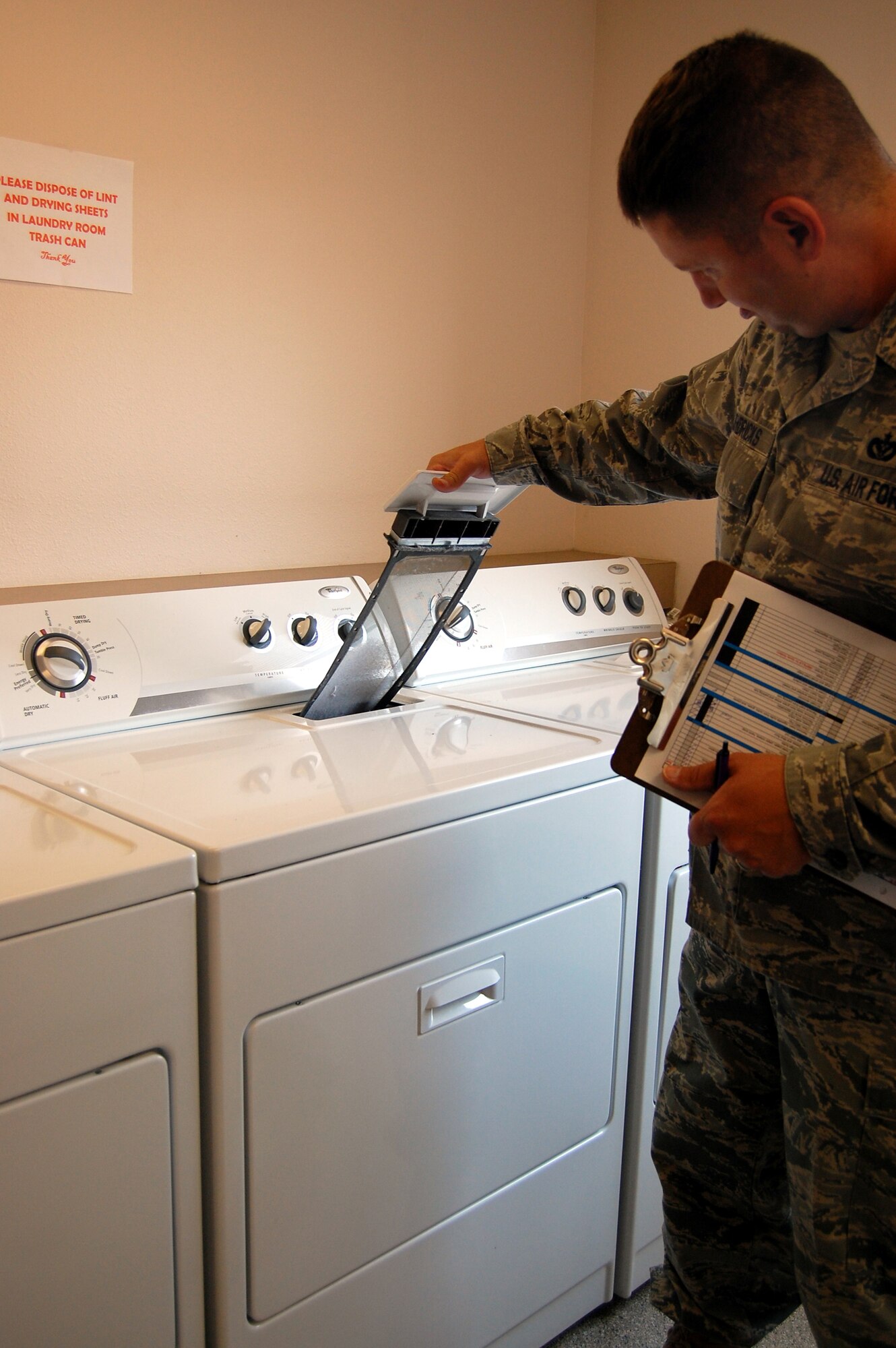 Staff Sgt. Terry Hendricks, a dormitory manager with the Central Dormitory Management Office, insepcts the dryers at Dorm 764 May 15. As part of the U-Kleen program for dormitory reseidents, insepctions are conducted in nine areas every Monday, Wednesday and Friday. (U.S. Air Force photo/Valerie Mullett)