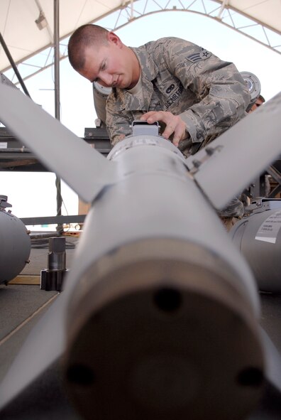 Senior Airman Richard Parvin, a 379th Expeditionary Maintenance Squadron munitions systems journeyman, inspects a KMU-572 fin assembly on a GBU-38 Version 1 bomb, May 22, 2009, at an undisclosed location in Southwest Asia.  The GBU-38s are assembled and constructed by the base's munitions unit for delivery by B-1B Lancers.  Airman Parvin hails from Birmingham, Ala. and is deployed from Dyess Air Force Base, Texas, in support of Operations Iraqi and Enduring Freedom and Combined Joint Task Force - Horn of Africa.  (U.S. Air Force photo/Senior Airman Andrew Satran/released)