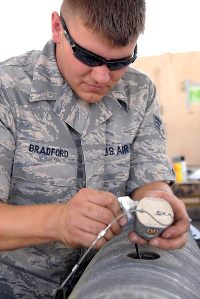 Senior Airman Timothy Bradford, a 379th Expeditionary Maintenance Squadron munitions systems journeyman, applies RTV lubricant onto an FZU-55 bomb fuze initiator for a GBU-38 Version 1 bomb, May 22, 2009, at an undisclosed location in Southwest Asia.  The FZU-55 is an air actuated generator which provides power for the fuze in the bomb.  The GBU-38s are assembled and constructed by the base's munitions unit for delivery by B-1B Lancers.  Airman Bradford hails from Burleson, Texas and is deployed from Dyess Air Force Base, Texas in support of Operations Iraqi and Enduring Freedom and Combined Joint Task Force - Horn of Africa.  (U.S. Air Force photo/Senior Airman Andrew Satran/released)