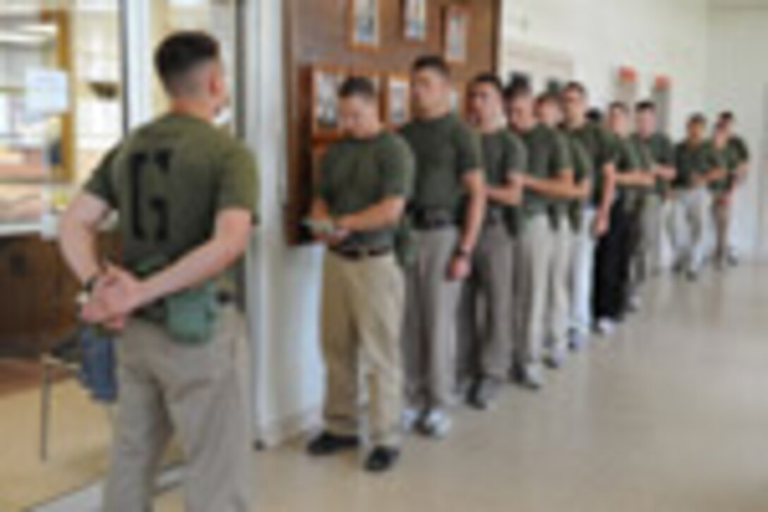 Candidates from Golf Company, Officer Candidate School, are given thier initial haircut prior to the start of their training aboard Marine Corps Base Quantico, Va., Monday, May 25, 2009. The candidates face 10-weeks of demanding training to screen and evaluate their leadership skills and determine whether they can efficiantly lead Marines. (U.S. Marine Corps photo by LCpl John Kennicutt/Not Released)