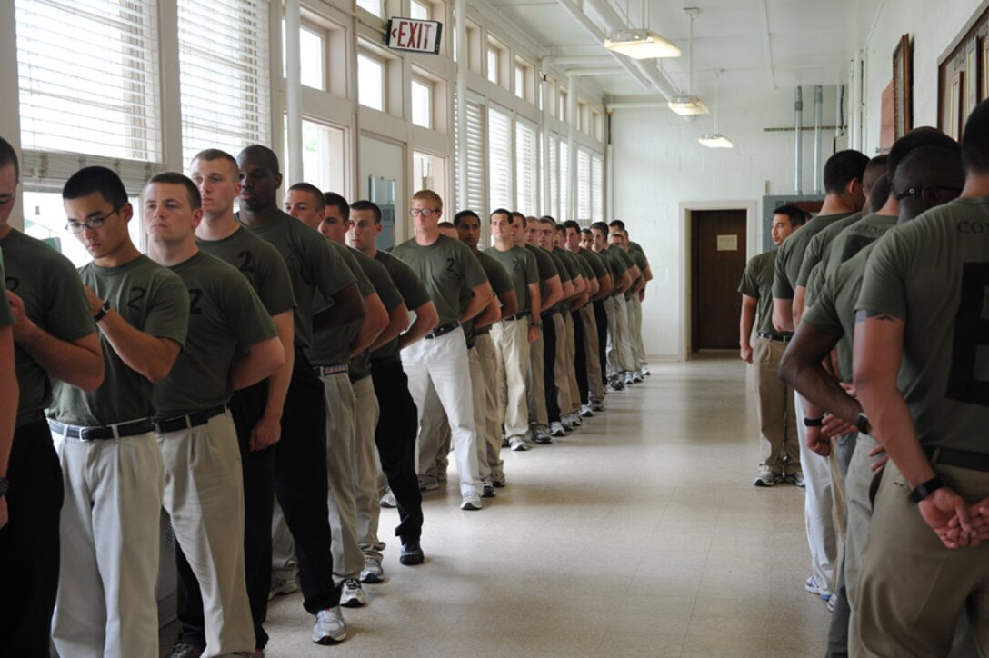 Candidates from Echo Company, Officer Candidate School, receive their initial haircuts aboard Marine Corps Base Quantico, Va., May 25, 2009.