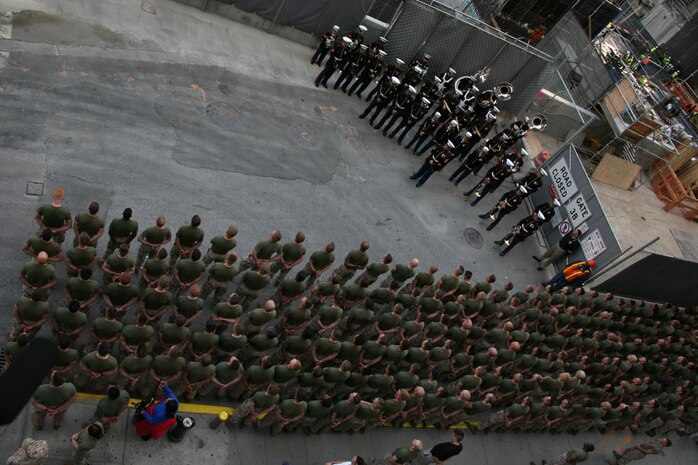 Marines from Special Purpose Marine Air Ground Task Force New York and the Marine Forces Reserve Band wait to begin a ceremony at Ground Zero. The Marines ran to Ground Zero where they laid a wreath to honor those who died in the 9/11 attack. Official Marine Corps photo by Sgt. Steve Cushman)