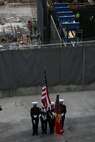The 24th Marine Expeditionary Unit color guard stands in front of Ground Zero as a part of a ceremony in New York City, May 26. Marines from Special Purpose Marine Air Ground Task Force New York led a run to the site and placed a wreath as a sign of respect for those who died in the 9/11 attacks. (Official Marine Corps photo by Sgt. Steve Cushman)