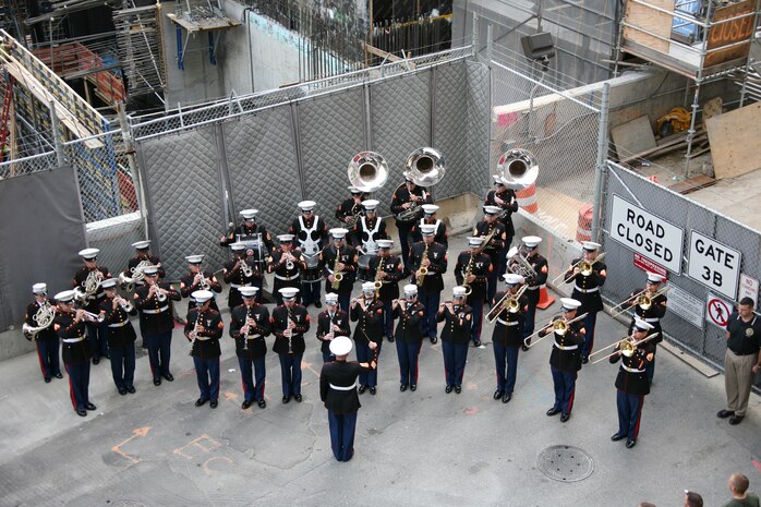 The Marine Forces Reserve Band plays during a ceremony at Ground Zero, New York City. The Marines of Special Purpose Marine Air Ground Task Force New York ran to Ground Zero where they laid a wreath to honor those who died in the 9/11 attack. (Official Marine Corps photo by Sgt. Steve Cushman)
