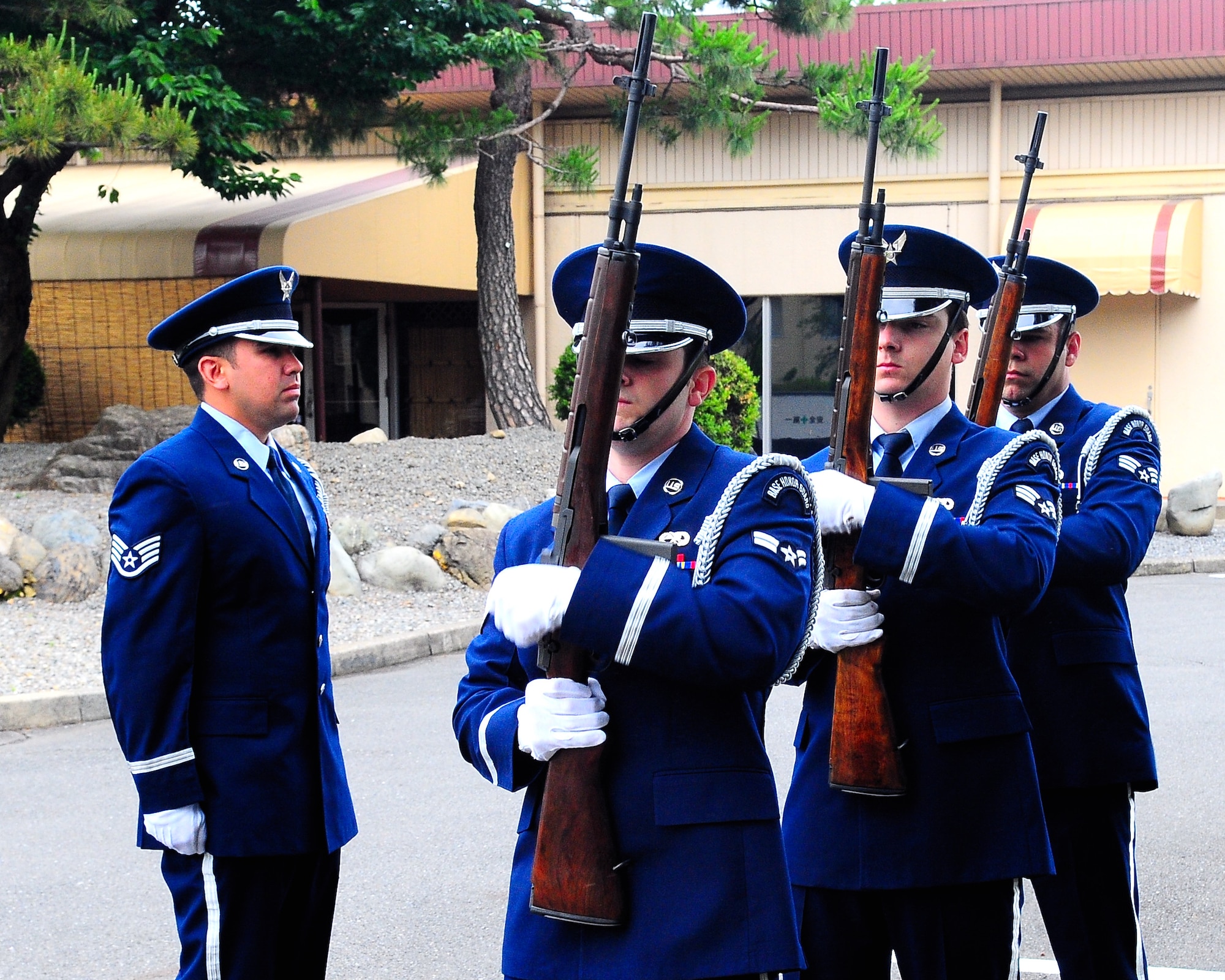 YOKOTA AIR BASE, Japan -- The Yokota Air Base Honor Guard fires three volleys May 25 during the American Legion Post 2222 Annual Memorial Day Ceremony at the officers' club memorial garden. First observed on May 30, 1868, at Arlington National Cemetery, Memorial Day honors those who have paid the ultimate price in defense of freedom. (U.S. Air Force photo/Airman 1st Class Michael Dillon)

