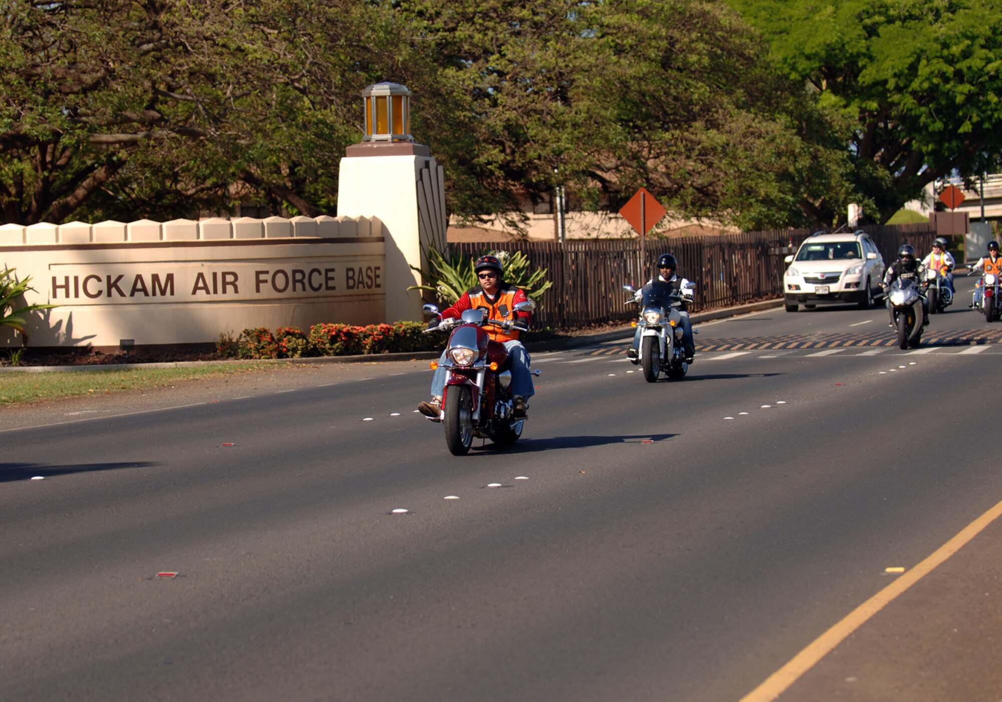 HICKAM AIR FORCE BASE, Hawaii – Motorcycle riders from Hickam Air Force Base head out with sister services for a ride around the island on the morning of May 22.  Hosted by the 15th Airlift Wing safety office, the event kicked off the 101 Critical Days of Summer and was held to promote motorcycle safety. It was also an opportunity for all Department of Defense motorcycle riders and potential riders on Oahu to meet with fellow riders and share experiences. The day's events included motorcycle and food venders and ended with a performance by two professional motorcycle stunt riders. (U.S. Air Force photo by Vanessa M. Perez)