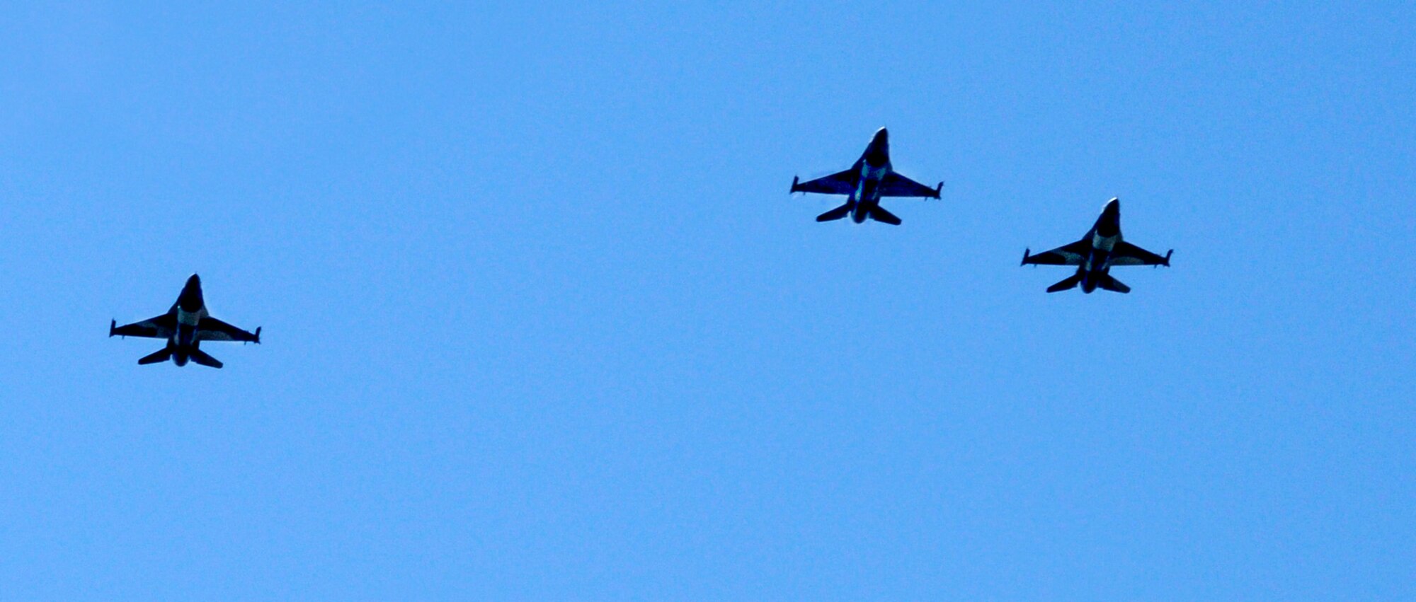 F-16 Fighting Falcons from the 354th Fighter Wing at Eielson Air Force Base, Alaska, fly in the missing man formation to honor all Americans who have given their lives in service to our nation during a Memorial Day ceremony at Birch Hill Cemetery May 25, 2009, Fairbanks, Alaska. (U.S. Air Force photo/Airman 1st Class Laura Max)