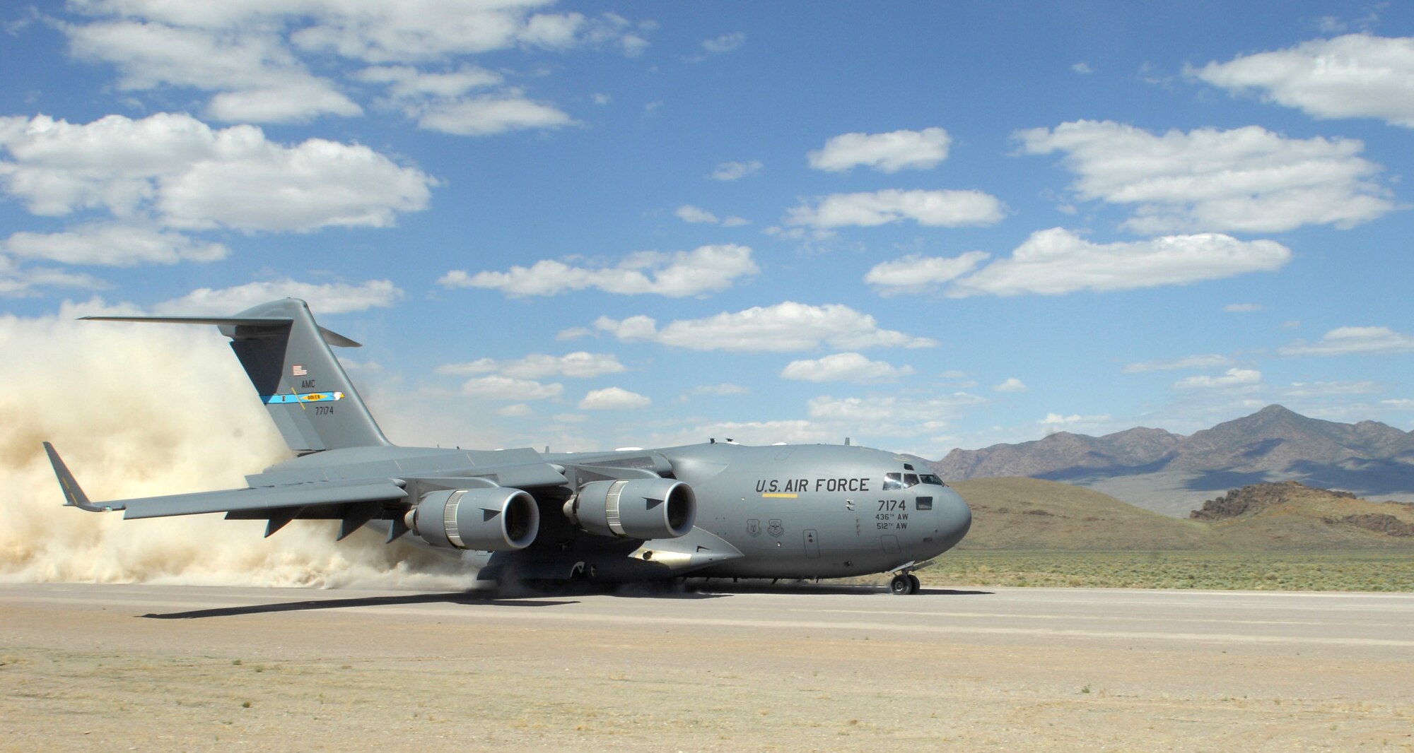 During the short take off and landing phase of the Mobility Air Forces Exercise, a C-17 Globemaster lII lands on a dirt landing zone at the Nevada Test and Training Range near Nellis Air Force Base, Nev.  The 29th Weapons Squadron provides advanced tactical training to C-130 Hercules aircrew selected to attend the Weapons School here. The six-month, graduate-level course culminates in a massive airlift mission, called the Mobility Air Forces Exercise. More than 30 airlift assets and hundreds of support personnel from across the Air Force participate in the biannual training exercise. (U.S. Air Force photo/Staff Sgt. Taylor Worley)