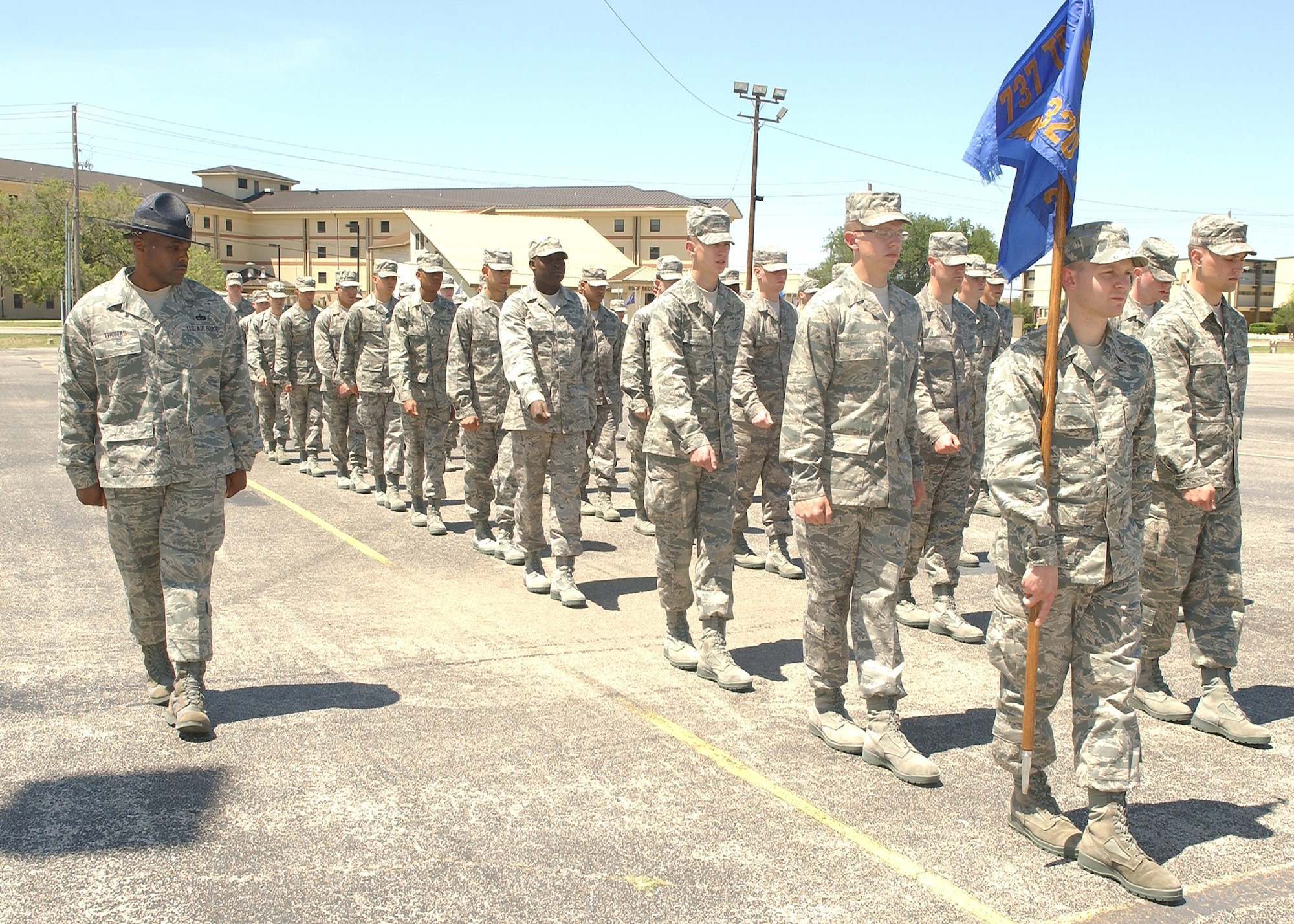 Tech. Sgt. James Thomas, 436th Logistics Readiness Squadron assistant NCO in-charge of vehicle management and currently Military Training Instructor assigned to the 320th Training Squadron at Lackland Air Force Base, Texas, marches his flight. Sergeant Thomas will be fulfilling six months of temporary duty to change the lives of 200 or more trainees. (U.S. Air Force photo/ Alan Boedeker)                               