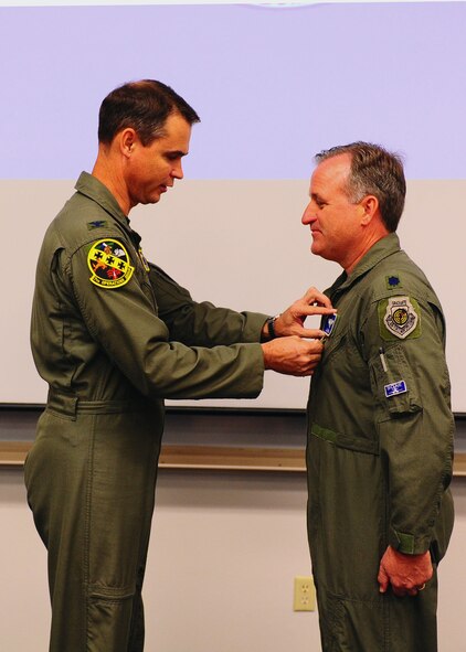 DYESS AIR FORCE BASE, Texas - Lt. Col. James Adamski receives the Bronze Star here May 26. (U.S. Air Force photo by Airman 1st Class Stephen Reyes)