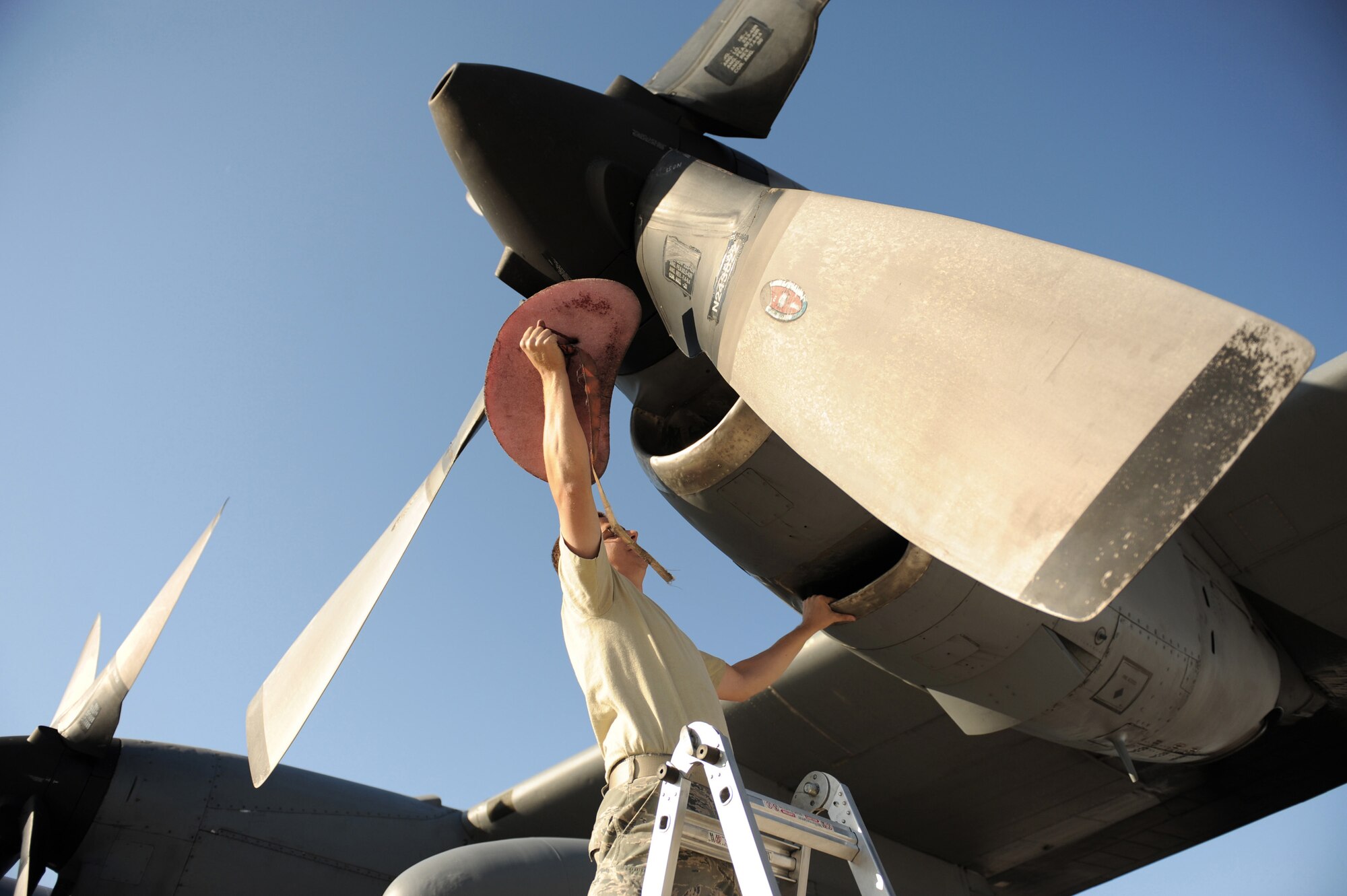 Staff. Sgt. Eric Jancaitis removes an engine intake plug May 20 in preparation for the Mobility Air Forces Exercise at Nellis AFB, Nev.  He is a C-130 Hercules crew chief assigned to the 314th Aircraft Maintenance Squadron at Little Rock Air Force Base, Ark. (U.S. Air Force photo/Senior Airman Larry E. Reid Jr.)

 
