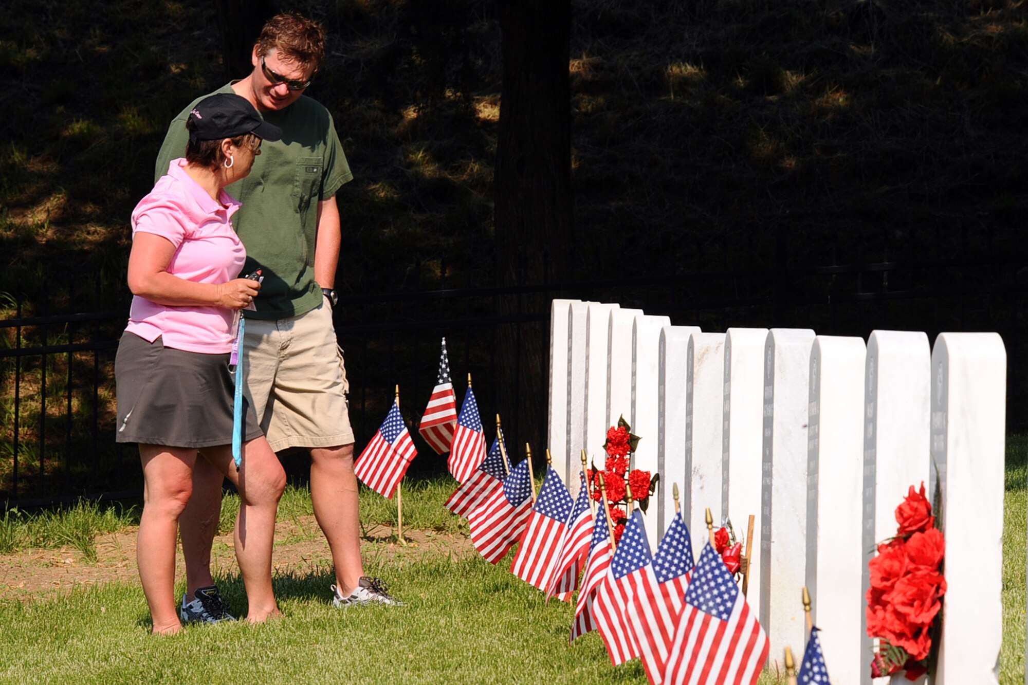 OFFUTT AIR FORCE BASE, Neb. - Teresa Siwa and her husband Joe, from Ralston, N.E., visit Teresa's grandparents, Floyd and Berda Moss after attending the  Memorial Day service at the Offutt Cemetery May 25.  The ceremony honors the men and women who've served and continue to serve in the United States military.U.S. Air Force Photo by Josh Plueger