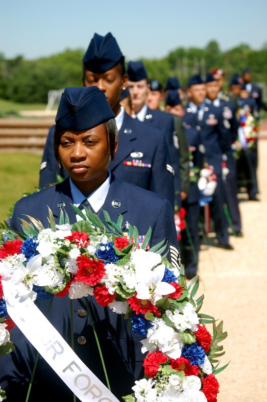 Airmen and Soldiers participate in the 2009 Parade of Wreaths ceremony at Pudgy Circle on Joint Base McGuire-Dix-Lakehurst, N.J., on May 21.  The ceremony included members from all branches of the armed forces and from state and local police agencies.  The ceremony is held in observance of National Police Week and Memorial Day.  (U.S. Air Force Photo/Tech. Sgt. Scott T. Sturkol)