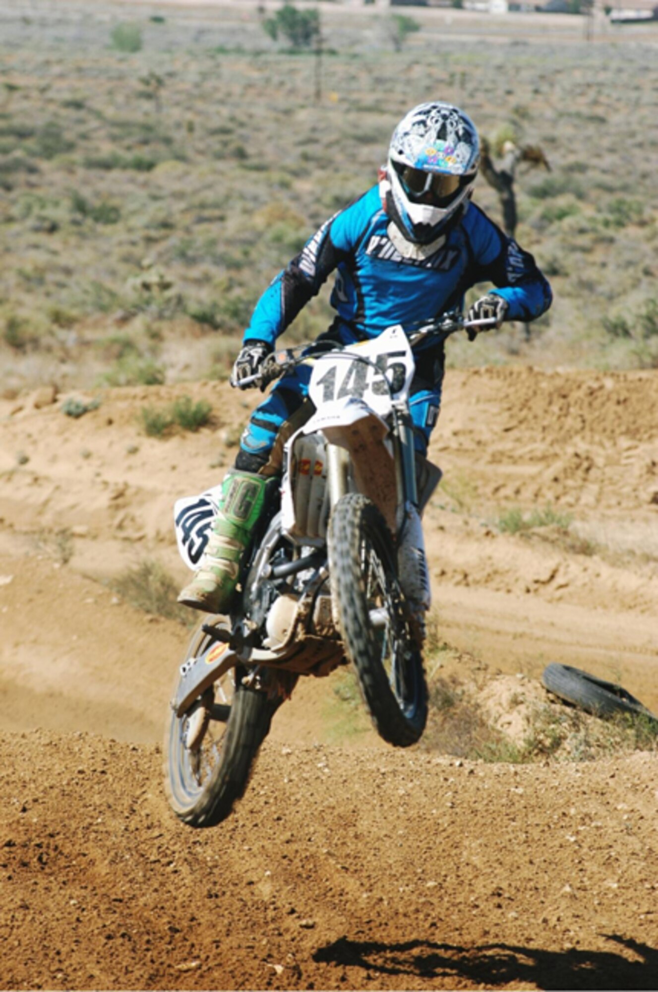 A participant gets air time on one of the track's jumps during the 32nd Annual J.B. Memorial Dunestown Series at Edwards dirt track May 17. Desert Wheels Motorcycle Club hosted the event while the race promoter is California Racing Club. (Photo by Gregory Robertson)
