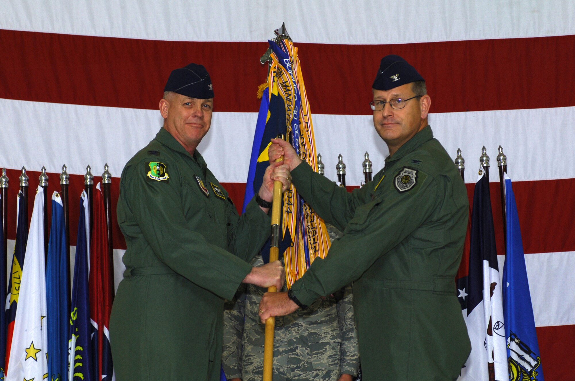 MINOT AIR FORCE BASE, N.D -- Col. Joel Westa, 5th Bomb Wing commander, passes the guidon to Col. Charles Patnaude, as Colonel Patnaude officially assumes command of the 5th Operations Group here May 20. (U.S. Air Force Photo by Tech. Sgt. Lee A. Osberry Jr.)

