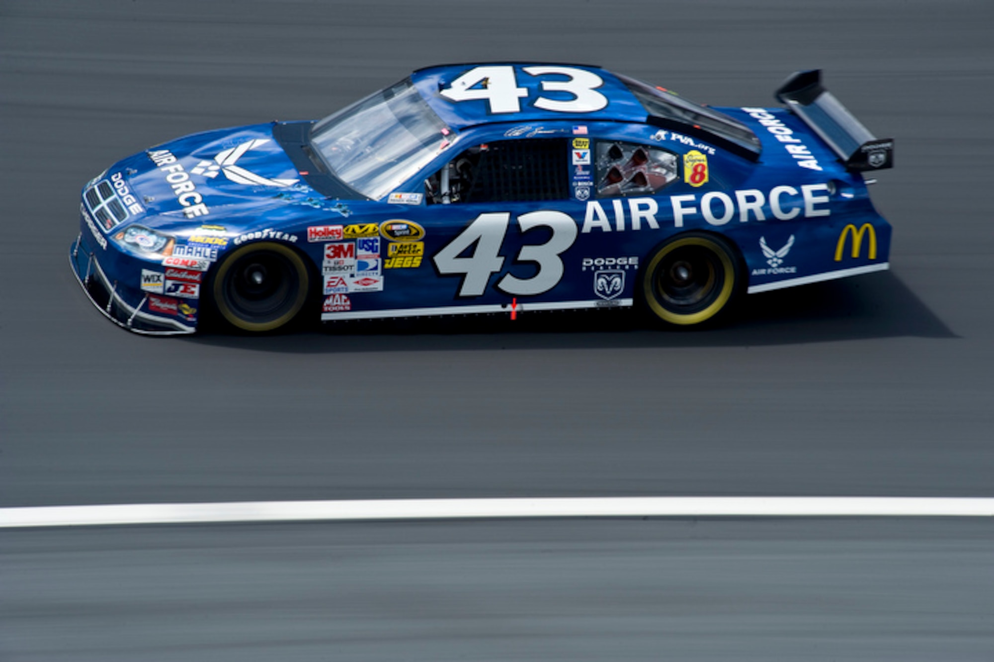 Reed Sorenson, NASCAR driver of the Richard Petty Motorsports #43 Air Force Dodge Charger, races around the Lowe's Motor Speedway at 186 mph during Coca-Cola 600 Sprint Cup race May 25. The #43 was painted in an Air Force paint scheme as a Salute to the Military for Memorial Day.
(U.S. Air Force photo by/Staff Sgt. Bennie J. Davis III)