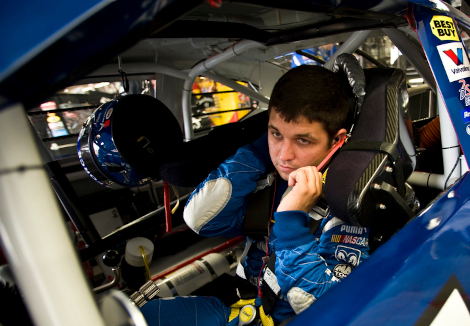 Reed Sorenson, NASCAR driver of the Richard Petty Motorsports #43 Air Force Dodge Charger, straps into his race car before practice trails May 23 in preparation for the Lowe's Motor Speedway Coca-Cola 600 Sprint Cup race, Charlotte, N.C.
(U.S. Air Force photo by/Staff Sgt. Bennie J. Davis III)