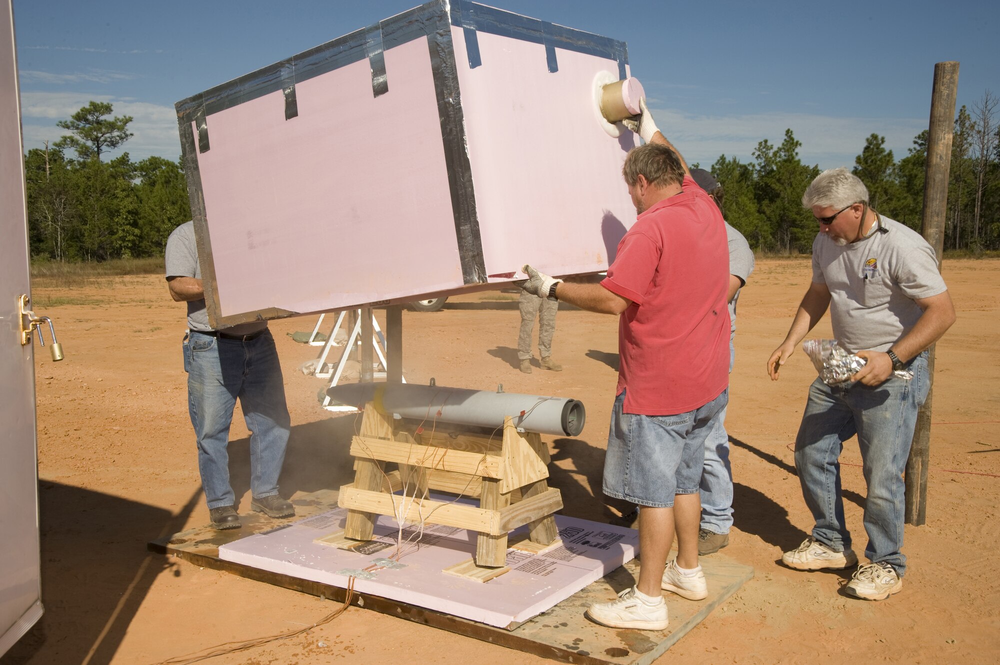 McDonnell Douglas workers remove the packaging of a Small Diameter Bomb warhead in this 2008 photo. (Air Force photo)
