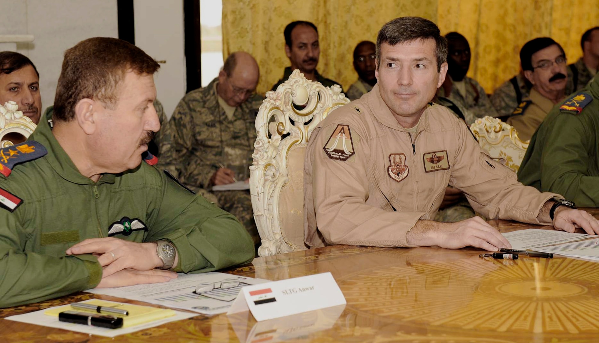 The Iraqi air force Commander, Staff Lieutenant General Anwar, and Brig. Gen. Robert Kane talk during the joint commanders' conference at Camp Victory, Iraq, May 20. General Kane is the 321st Air Expeditionary Wing and Coalition Air Force Training Team commander.(U.S. Air Force photo/Senior Airman Jacqueline Romero)