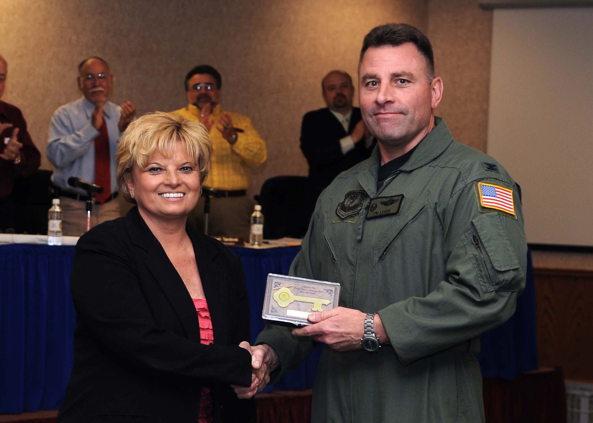 CANNON AIR FORCE BASE, N.M. -- Clovis, N.M. Mayor Gayla Brumfield presents Col. Timothy Leahy, 27th Special Operations Wing commander, with the key to the city May 21.  Colonel Leahy, who will become as an assistant to Adm. Eric Olson, United States Special Operations Command commander, received the award during a city commission meeting. (U.S. Air Force photo by Staff Sgt. Heather Redman)