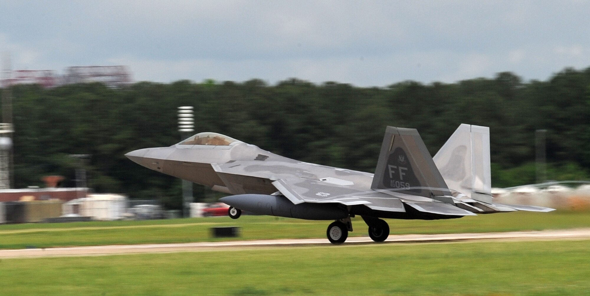 LANGLEY AIR FORCE BASE, Va. – An F-22A Raptor from the 94th Fighter Squadron takes off here May 26 for Kadena Air Base, Japan.  More than 280 Langley Airmen and 12 F-22A Raptors depart this week for their Air Expeditionary Force deployment, which demonstrates the continued U.S. commitment to fulfill its security responsibilities throughout the Western Pacific.  This is the first overseas deployment for the 94th Fighter Squadron since transitioning to the F-22.  (U.S. photo/Senior Airman Zachary Wolf)