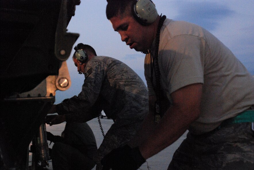An Alamo Wing C-5A Galaxy cargo aircraft is being photographed for the cover of Airman Magazine against a Texas sunrise on the flightline of Lackland AFB. The 433rd Airlift Wing's Maintenance Squadron readied the aircraft in the pre-dawn darkness. (U.S. Air Force Photo/Airman Brian McGloin)
