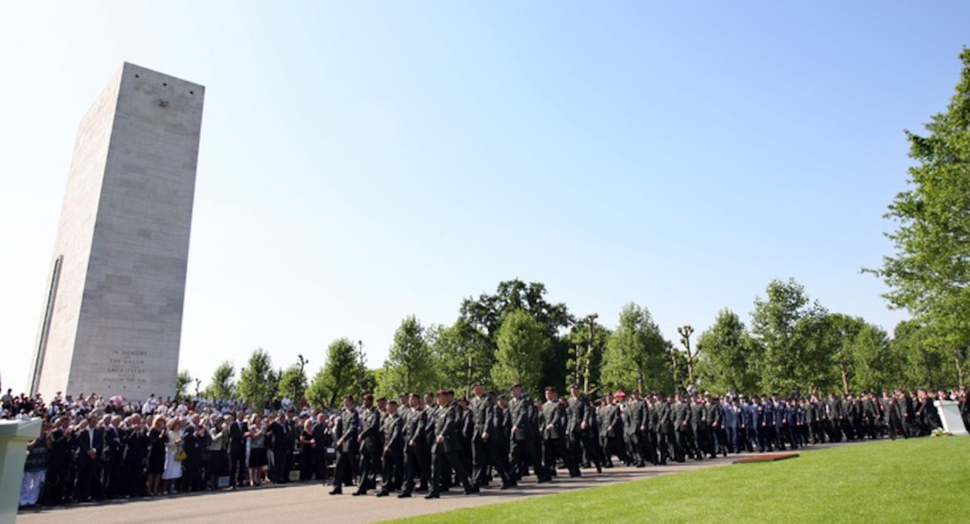 MARGRATEN, The Netherlands – An international military formation pays tribute to men and women who died while serving in the military May 24, 2009 during a Memorial Day ceremony at the Netherlands American Cemetery and Memorial. There are 8,302 soldiers buried there under rows of white crosses and stars of David. All of the graves are adopted by locals, who occasionally tend to the graves and lay flowers. (Courtesy photo)