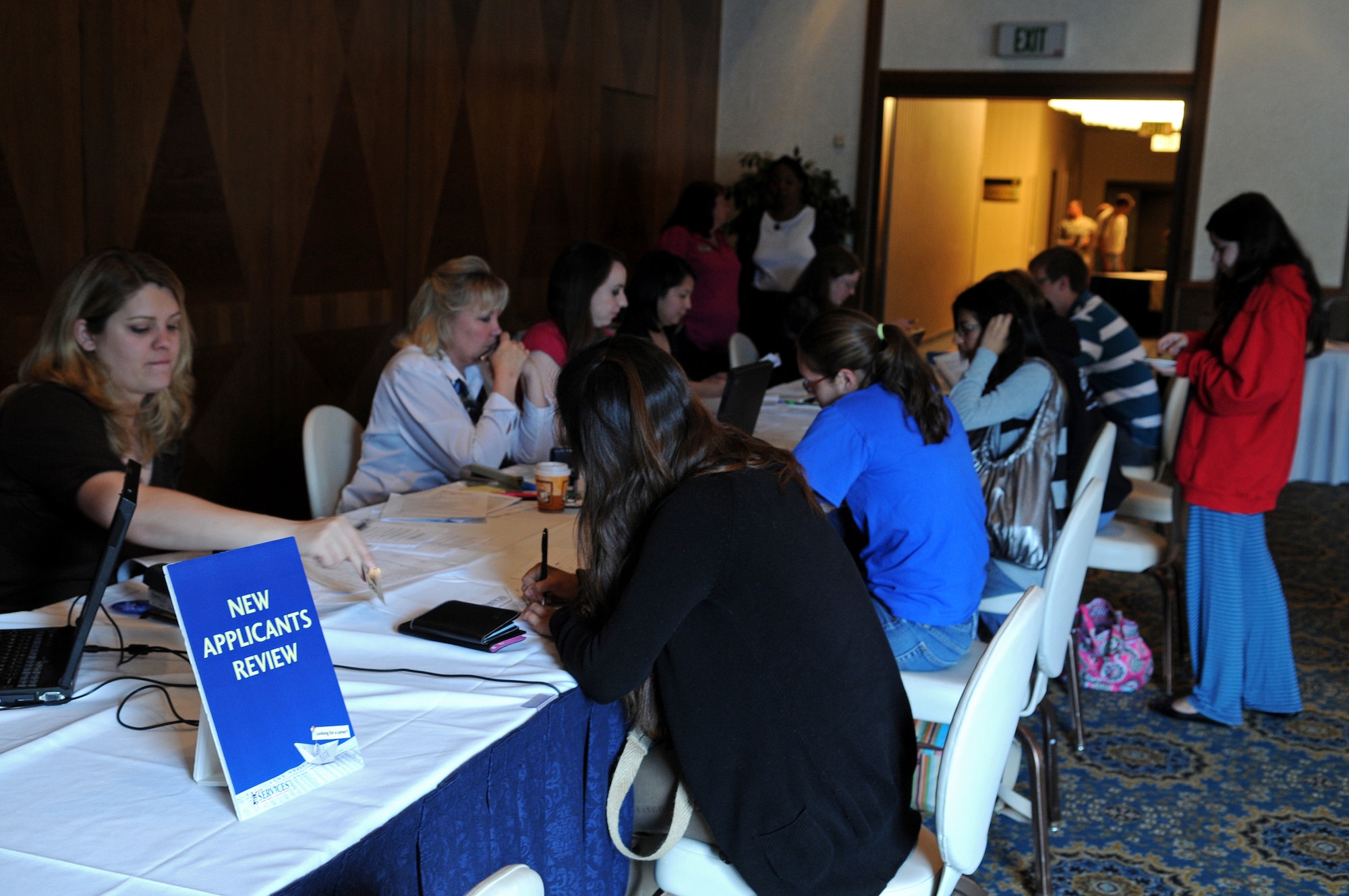 Civilians and dependants apply for jobs at the 435th Services Job Fair held on Ramstein Air Base, Germany, May 18, 2009. The 435th SVS plans to employ more than 650 civilians, dependents and off-duty military hires for the upcoming KMCC. (U.S. Air Force photo by Airman 1st Class Grovert Fuentes-Contreras)