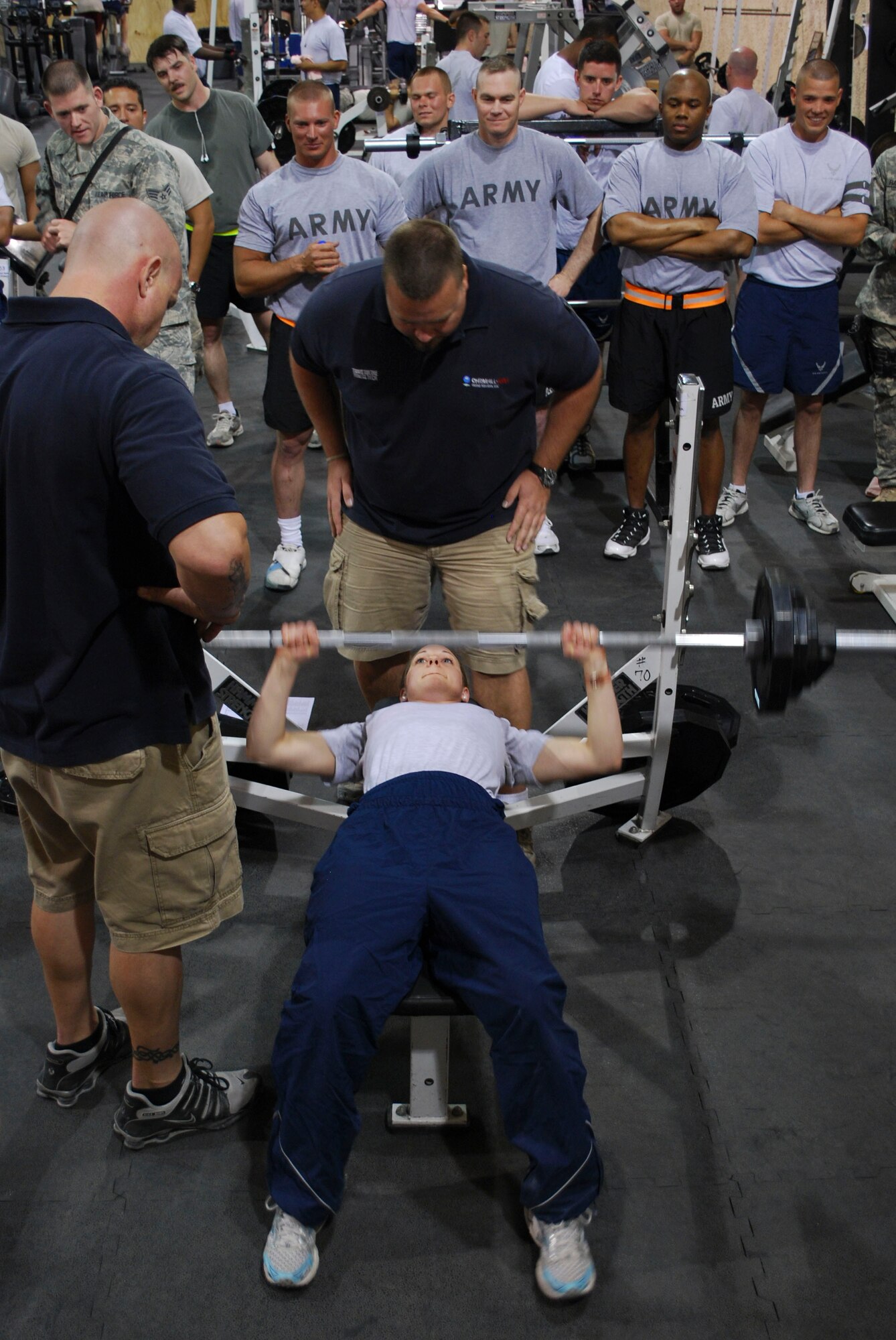 1st. Lt. Katherine Loffer, Task Force Med, bench presses 135 pounds in "The Rock" gym at Bagram Air Field, Afghanistan, May 15. The 455th Expeditionary Force Support Squadron held a bench press competition open to all members of Bagram, consisting of lifting one's body weight as many times unitl failure. Lieutenant Loffer placed first in the women's category, winning a iPod Shuffle. She is deployed from Little Rock Air Force Base, Ark. and hails from Marietta, Texas. (U.S. Air Force photo/Senior Airman Erik Cardenas)