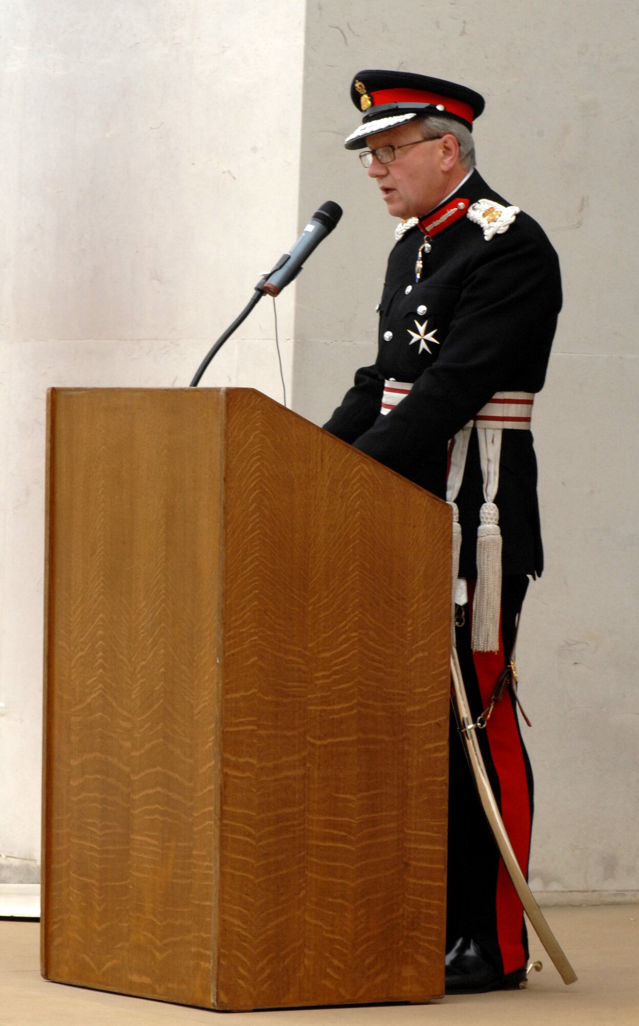 Hugh Duberly, Her Majesty's Lord-Lieutenant of Cambridgeshire, speaks to a somber audience during the Memorial Day ceremony at Madingley Memorial Cemetery, May 25, 2009.  The event included a wreath laying and a 21-gun salute.  (U.S. Air Force photo by Senior Airman Christopher L. Ingeroll)